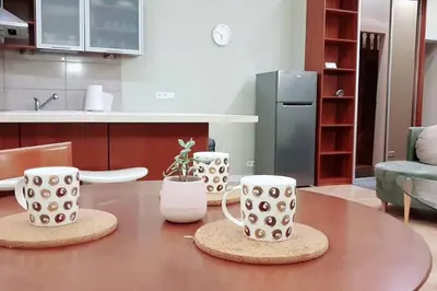 a table with two coffee cups on top of it at Bright&comfy apt -few min to Main Square in Kraków