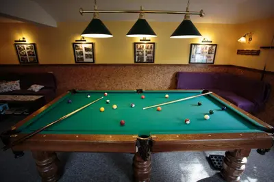 a pool table with balls on it in a room at REKLINIEC in Myślenice