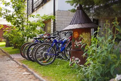 a row of bikes parked next to a building at Ośrodek Wypoczynkowo-Szkoleniowy HALNY in Zawoja