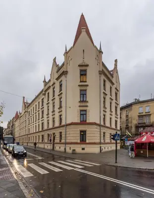 a large building on the side of a street at Old Town Apartment DeLux Kraków in Kraków
