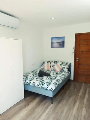 a small bedroom with a bed with at ZŁOTA PASIEKA Zator Przeciszów in Przeciszów