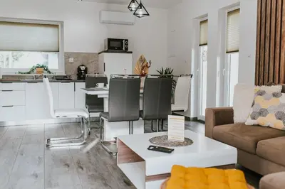 a living room with a couch and a table at APARTAMENTY LAS Zator in Zator