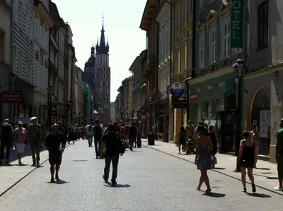 a group of people walking down a city street at FLORIANSKA Penthouse DeLux in Kraków