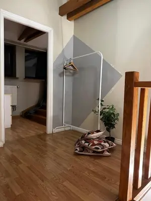 a living room with a glass wall and a floor at FLORIANSKA Penthouse DeLux in Kraków