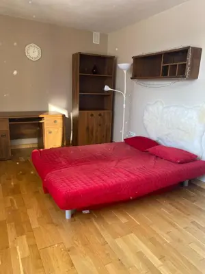 a bedroom with a large red bed in a room at Apartament w górach Gorce in Nowy Targ