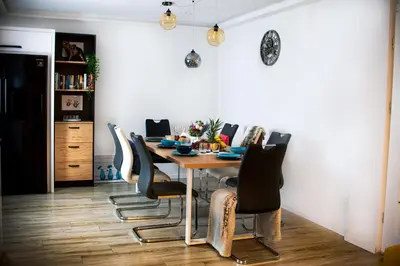 a dining room with a table and chairs at LaVerde - Blisko Przyrody Daleko od Tłumu in Skomielna Czarna