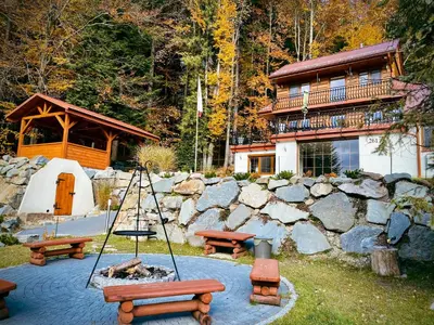 a group of picnic tables and a building with a house at LaVerde - Blisko Przyrody Daleko od Tłumu in Skomielna Czarna