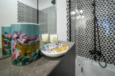 a bathroom with a bowl of food on a counter at PRZEPIĘKNY APARTAMENT w sercu Starego Miasta in Kraków