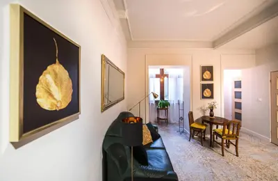a living room with a couch and a table at WSPANIAŁY, Stylowy Apartament w Sercu Starego Miasta in Kraków