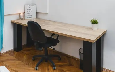 a desk in a room with a black chair at Krasińskiego Apartments - LOW STANDARD - Riverside & Old Town - by Upstairs in Kraków