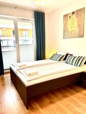a large bed in a room with a large window at Froja in Zator