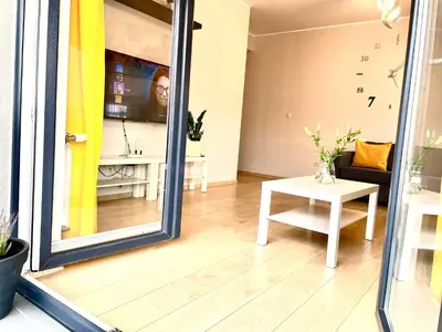 a living room with a mirror and a table at Froja in Zator
