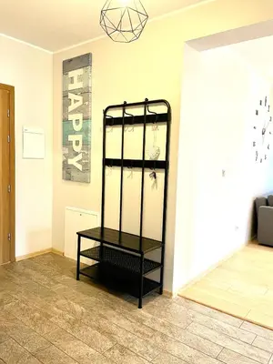 a black shelf in the corner of a room at Froja in Zator