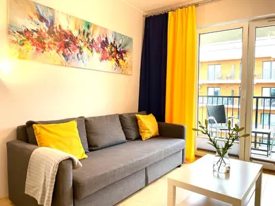 a living room with a couch and a table at Froja in Zator