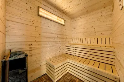a wooden cabin with a sauna at Domki Magnolia Noclegi & SPA Zator in Zator