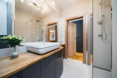 a bathroom with a sink and a mirror at Glam Brewery Suite - Deluxe Apartment with Parking - by Upstairs in Kraków