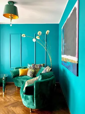 a living room with blue walls and a green couch at DREAM Boutique Apartment 42m2 in the heart of Cracow Old Town in Kraków