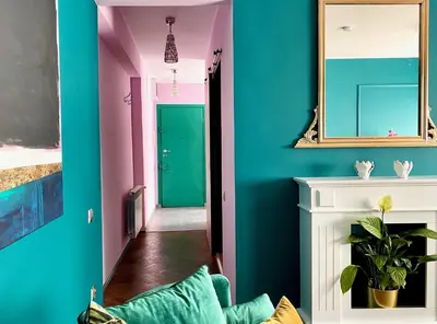 a living room with blue and pink walls at DREAM Boutique Apartment 42m2 in the heart of Cracow Old Town in Kraków