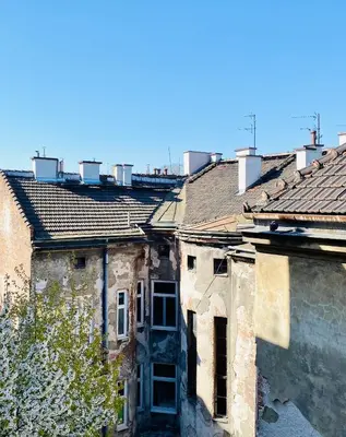 a group of old buildings with roofs at DREAM Boutique Apartment 42m2 in the heart of Cracow Old Town in Kraków