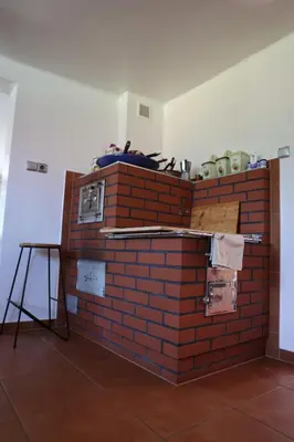 a stack of brick walls in a room at Agroturystyka u Babci in Czchów