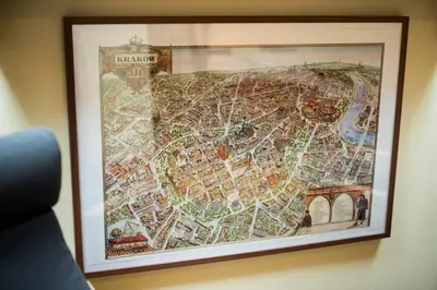 a framed map of a city on a wall at Bright loft in amazing location in Kraków