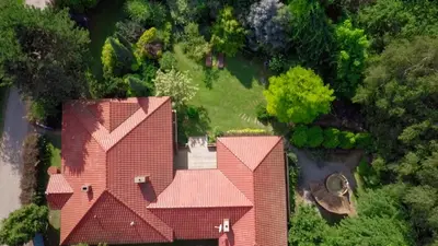 an overhead view of a house with red roof at Secret Garden Residence in Paszkówka