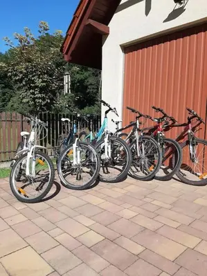 a group of bikes parked next to a building at Dom na polanie in Brzeźnica