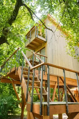 a kitchen in a log cabin with two windows at Apartamenty wśród drzew River Park Zator SPA JACUZZI in Zator