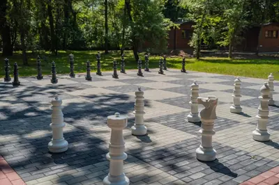 an overhead view of a chess board in a park at Apartamenty wśród drzew River Park Zator SPA JACUZZI in Zator