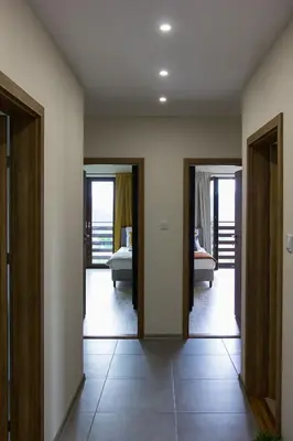 a room with two doors and a room with a bedroom at Barwald Hills - jacuzzi i piękny widok na Babią Górę i Beskidy in Wadowice
