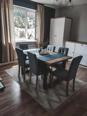 a dining room table and chairs in a kitchen at Jaszczurowa Apartament in Jaszczurowa