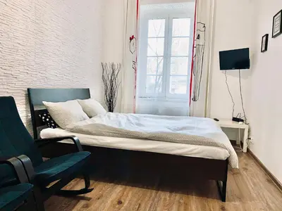 a living room with a couch and a table at Apartament w centrum :) in Kraków