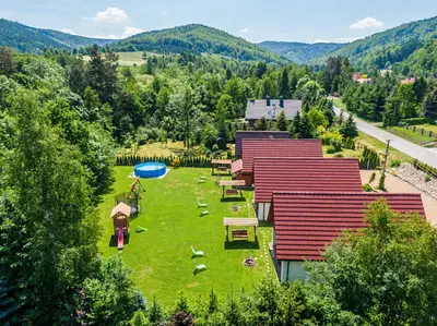 an aerial view of a large yard with tables and chairs at Domki Pod Czarnym Groniem in Rzyki