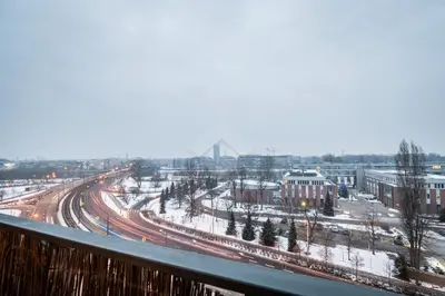 a view from a balcony of a city with snow at Kraków City Center Luxury Apartment in Kraków