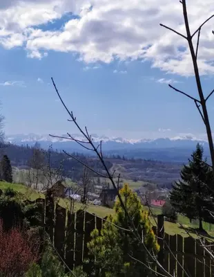 a view from the top of a hill with a fence at Widokowa Chata in Obidowa