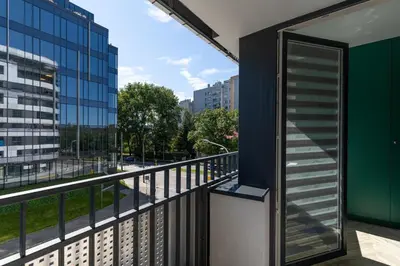 a balcony with a view of a city at WawelSee Apartments in Kraków