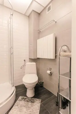 a bathroom with a toilet and a sink and a tub at DeLux Apartament OldTown Kochanowskiego 30 Kraków in Kraków