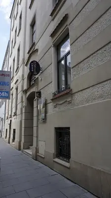 a building with a window on the side of it at AMBER APARTAMENt 10 in Kraków
