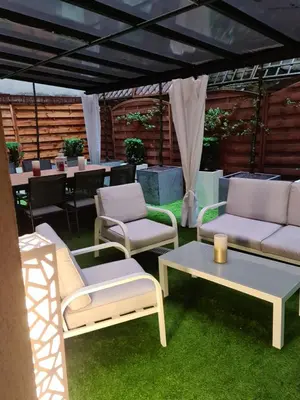 a group of chairs and tables under a tent at AMBER APARTAMENt 10 in Kraków