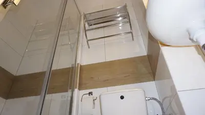 a shower stall in a bathroom with a toilet at AMBER APARTAMENt 10 in Kraków