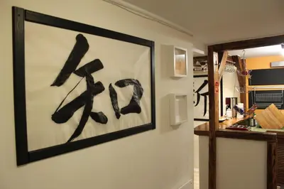 a painting on a wall with writing on it at Samurai - Old Town, Main Square, Main station in Kraków