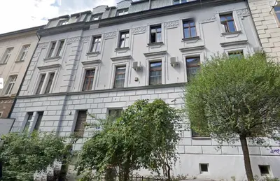 a white building with trees in front of it at Samurai - Old Town, Main Square, Main station in Kraków
