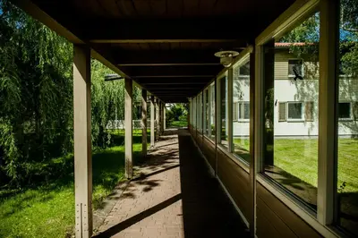an empty porch of a house with windows at Międzynarodowy Dom Spotkań Młodzieży w Oświęcimiu in Oświęcim