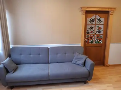 a wooden desk with a chair and a television at SECESJA HOUSE in Oświęcim