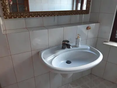 a kitchen with a sink and a window at SECESJA HOUSE in Oświęcim