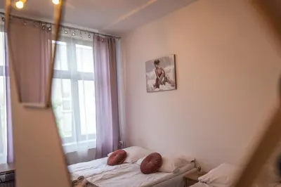 a small bedroom with a bed and a window at Willa Zator in Oświęcim