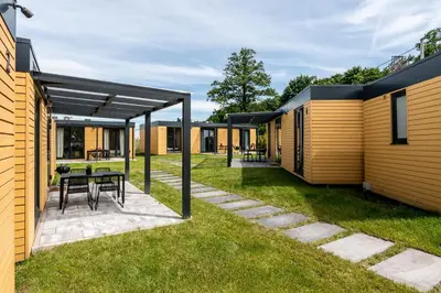 a view of the backyard of a modular house at ZATORHOUSE in Zator