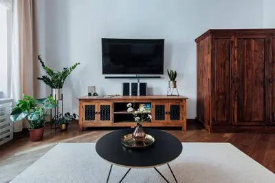 a living room with a tv and a coffee table at Szpitalna 20 Apartment nr 8 in Kraków