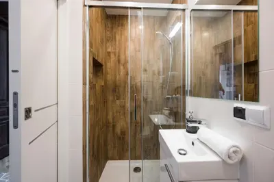 a bathroom with a shower and a white sink at Beautiful apartment, great location, Old Town & Kazimierz in Kraków