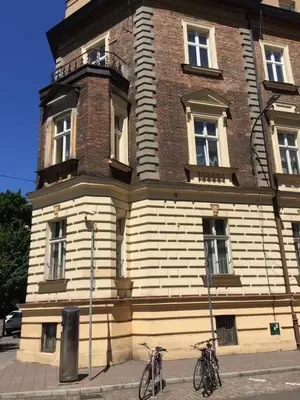 two bikes parked in front of a building at Coco apartment 1 in Kraków